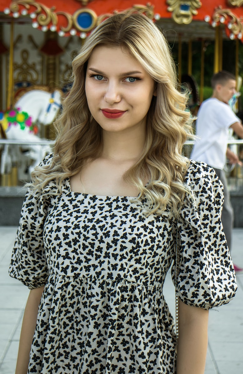 woman in black and white leopard print dress