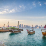 dhows moored off museum park in central doha qatar arabia with some of the buildings from the citys commercial port in the background stockpack adobe stock| وظائف شركة نيس جلوبال تالنت لجميع الجنسيات في قطر
