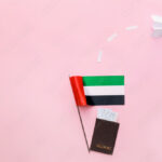 national united arab emirates flag passport and paper plane on pink background stockpack adobe stock| وظائف شركة دوام لجميع الجنسيات بمختلف التخصصات في الامارات
