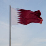 qatar flag flying high in the wind stockpack adobe stock| وظائف مدرسة نوبل الدولية في مجال التدريس برواتب مجزية في قطر