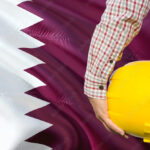 qatari engineer is holding yellow safety helmet with waving qatar flag background construction and building concept stockpack adobe stock| وظائف مؤسسة قطر للتربية والعلوم وتنمية المجتمع للرجال والنساء توظيف دولة قطر اليوم