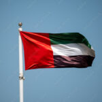 United Arab Emirates national flag cloth fabric waving on sky. UAE national flag