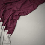 waving national flag of qatar on a gray background stockpack adobe stock| وظائف شركة كيوبيك لجميع الجنسيات برواتب مجزية في قطر
